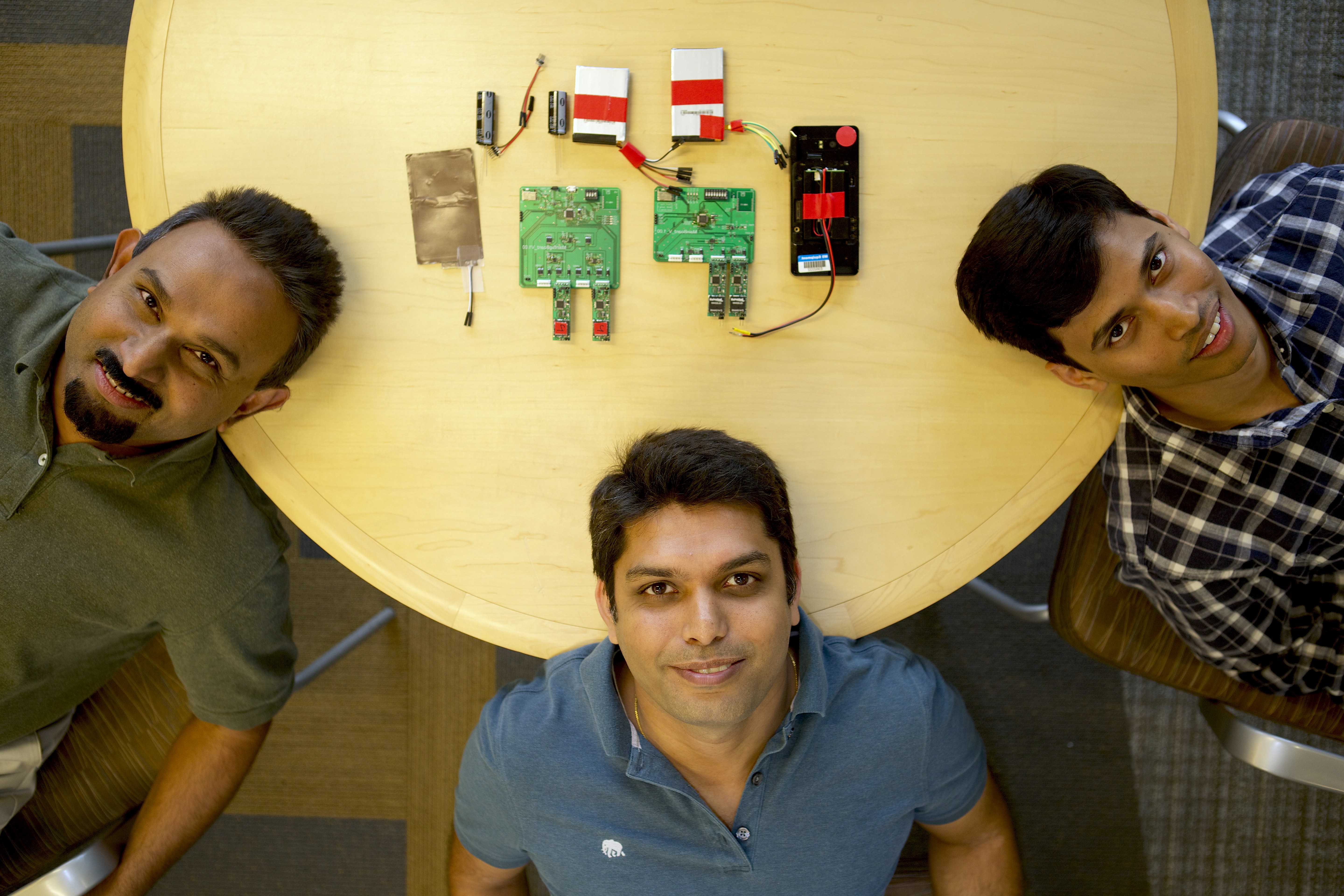Microsoft researchers Bodhi Priyantha, Ranveer Chandra and Anirudh Badam are among the researchers who worked on the new approach to extending gadget battery life. Photo credit: Jeremy Mashburn/Microsoft.